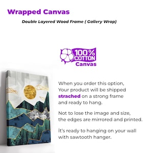 May include: Wrapped canvas art print with a double-layered wood frame. The artwork features a gold sun and geometric mountain design in shades of teal, gray, and gold. The canvas is 100% cotton and ready to hang.