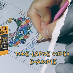 May include: A cassette tape labeled "Paws & Rewind Mascot Edition" featuring cartoon cats. The image also shows a person's hand drawing with a pink pencil on a paper with the text "Time-Lapse Video Example".