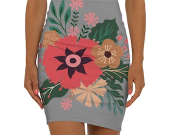May include: A grey mini skirt with a floral design. The skirt has a fitted shape and is decorated with a vibrant arrangement of red, pink, and peach flowers, along with green leaves and stems. The floral pattern is centered on the skirt.