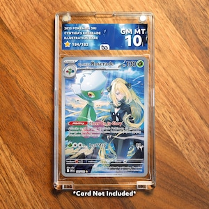 May include: A graded Pokémon card featuring Cynthia's Roserade illustration. The card is encased in a clear protective holder, with a blue label indicating a grade of 10. The card's artwork depicts a green and white floral creature and a blonde woman.