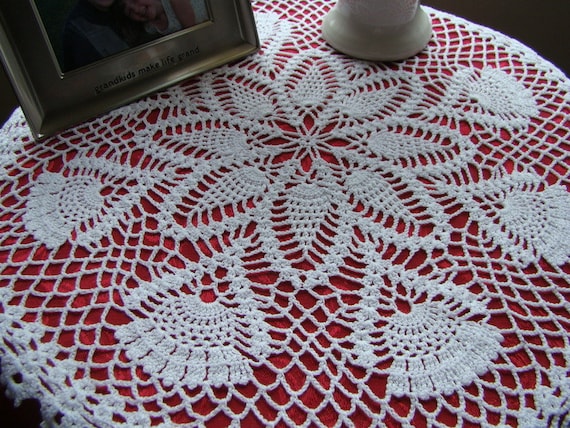 White kaleidoscope and pinwheel crochet table topper doily