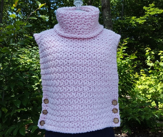 Hand crocheted pink Aura turtleneck pullover sleeveless sweater with wooden buttons and custom stitching