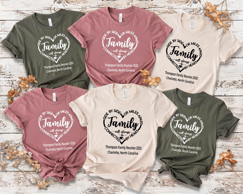 May include: Six short-sleeved crew neck t-shirts in olive green, dusty rose, and cream. Each shirt features a heart-shaped graphic with the text: Side by side or miles apart, Family will always be connected by heart, Thompson Family Reunion 2025, Charlotte, North Carolina.