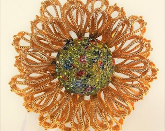 Beautiful Unsigned Designer Brooch made of Twisted Gold Tone Metal and Unusual Color Rhinestones in Greens Yellows and Golds