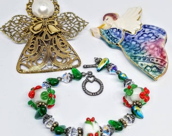 Christmas Jewelry Lot Lampwork and Crystal Bracelet 2 Angel Pins 1 Ceramic Tile Like Material 1 Gold Tone Filigree with Faux Pearl and Bow