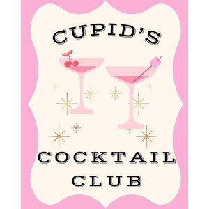 May include: A pink and cream-colored sign with the text "CUPID'S COCKTAIL CLUB". The sign features two pink cocktail glasses with cherries and a marshmallow garnish. Gold starbursts and a pink border complete the design.