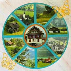 May include: A circular collage featuring scenic views of houses, churches, and landscapes, set within a teal frame. Two yellow butterfly cutouts are placed on the top and bottom. The central image is a house with a brown roof and red shutters.