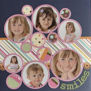 May include: A scrapbook page with multiple photos of children in circular frames with pink stitching. Decorative circles with patterns and flowers surround the photos. The word "smiles" is cut out in green letters on the bottom right.