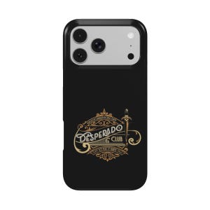 May include: A black smartphone case featuring a graphic design with the text "DESPERADO CLUB" in a stylized font, accompanied by a dagger illustration and ornate scrollwork in shades of gold and white on a solid black background.