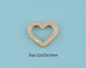 May include: Gold-colored heart-shaped clasp with a sparkling, gem-studded surface. The clasp is 22mm x 25mm x 3mm in size. The clasp is set against a light blue background.