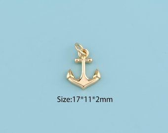 May include: A gold-colored anchor pendant with a loop at the top for attaching to a chain or cord. The anchor measures 17mm x 11mm x 2mm. The pendant is set against a light blue background.
