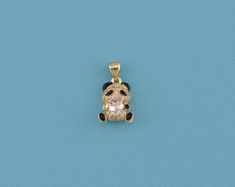 May include: A gold-colored panda pendant with black accents on the ears, eyes, and feet. The panda's body is encrusted with clear crystals, and it holds a heart-shaped crystal in its center. The pendant hangs from a gold bail.