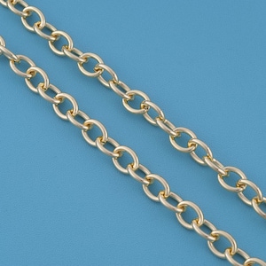May include: A gold-toned metal chain featuring a series of uniform, oval-shaped interlocking links. The chain is arranged in two parallel lines, showcasing the smooth, reflective surface and consistent construction of each individual link.