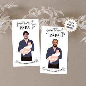 May include: Two white cards with illustrations of men holding babies. The cards have the text "quien tiene el PAPA?" and "RASACAR PARA REVELAR". One card has a star-shaped sticker that says "FREE & FAST U.S SHIPPING".