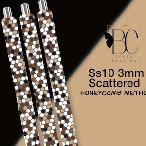May include: Three long, thin cylindrical pens featuring a repeating pattern of small white, tan, brown, and black circles. The text on the right reads BC Bells Creations, Ss10 3mm Scattered, HONEYCOMB METHOD, with a small black butterfly icon.