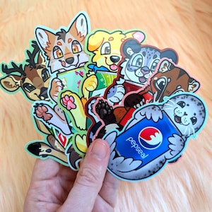 May include: A collection of die-cut vinyl stickers featuring cartoon animals, including a deer, a fox, a yellow dog, a snow leopard, and a spotted seal holding a blue soda can with the text pepseal printed in white and a red and blue circular logo.