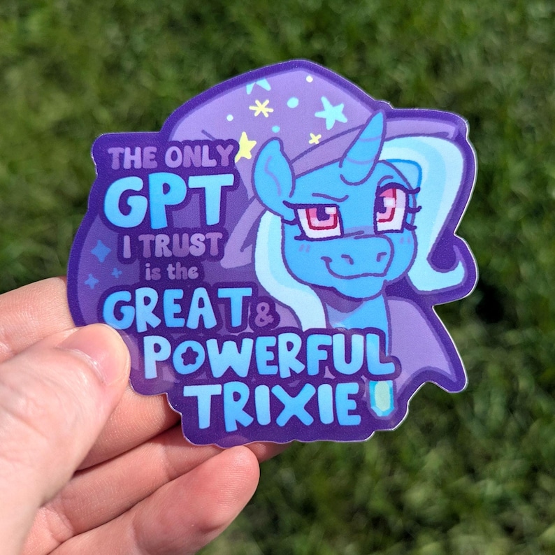 May include: A die-cut sticker featuring a blue unicorn character wearing a purple wizard hat with yellow stars. The text reads: THE ONLY GPT I TRUST is the GREAT & POWERFUL TRIXIE. The design uses shades of blue, purple, and white with a glossy finish.