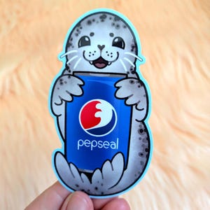 May include: A die-cut sticker featuring a gray spotted seal with a smiling expression, holding a blue soda can. The can displays a red and white circular logo with the text pepseal in white lowercase letters against a bright blue background.