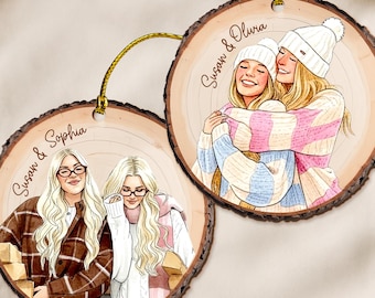 May include: Two wooden ornaments with illustrations of women. One shows two women in a plaid jacket and sweater, the other shows two women hugging, wearing hats and sweaters. Each ornament has a gold string for hanging.