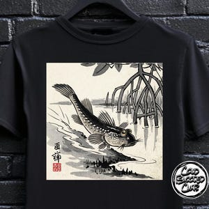 May include: Black t-shirt featuring a Japanese-style illustration of a fish leaping from water, with mangrove roots in the background. The design includes Japanese characters and a small red seal. The shirt has a round neck.
