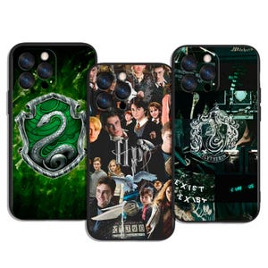 May include: Three phone cases featuring designs inspired by the Harry Potter series. One case displays the Slytherin crest, another showcases a collage of characters, and the third features the Slytherin crest and the words "Exist".