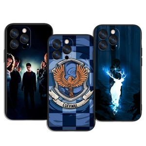 May include: Three black phone cases with different designs. One case features a group of people, another has a blue and white checkered pattern with a crest and the word "CORVINAL", and the third depicts a glowing deer in a forest.