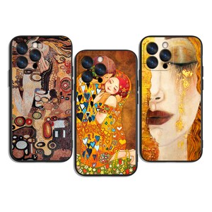 May include: Three phone cases featuring artwork by Gustav Klimt. The cases display iconic paintings with gold, brown, and colorful accents. The designs include "The Kiss" and other portraits, offering a blend of art and phone protection.