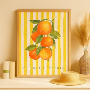 May include: A framed watercolor print featuring a cluster of ripe oranges with green leaves against a yellow and white striped background. The text "Sapori d'Estate" is at the bottom. The frame is light brown.