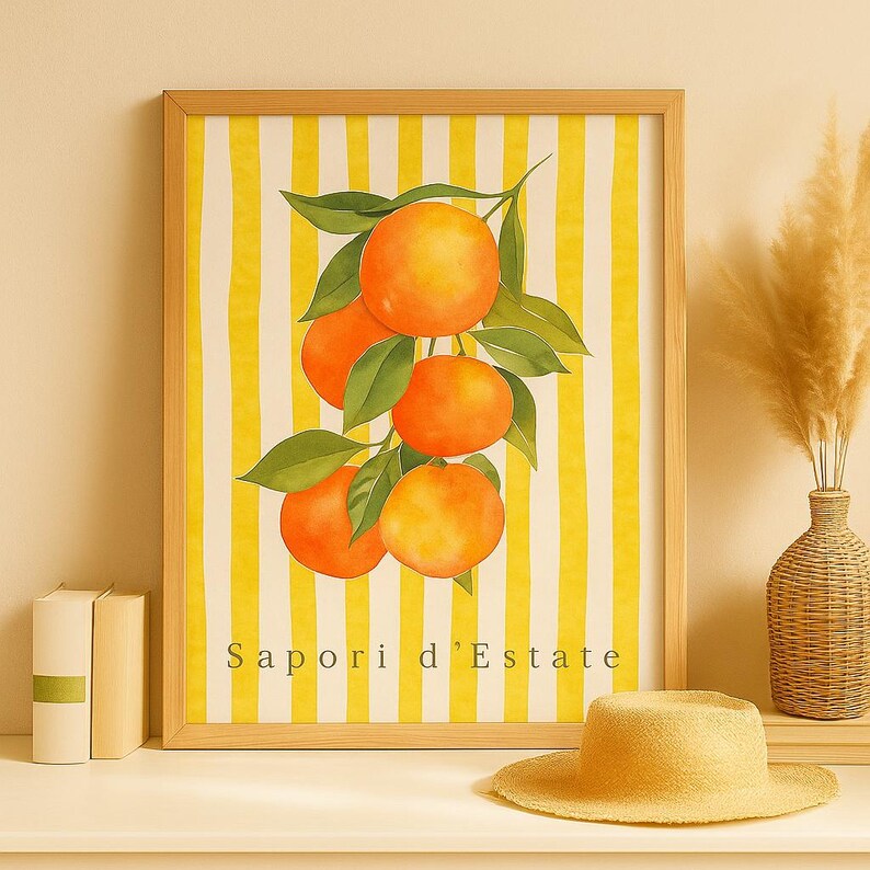 May include: A framed watercolor print featuring a cluster of ripe oranges with green leaves against a yellow and white striped background. The text "Sapori d'Estate" is at the bottom. The frame is light brown.