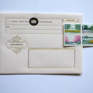 May include: A cream-colored envelope with gold trim and the text "POST OFFICE TELEGRAM" printed on the front. The envelope has a decorative stamp with the text "PLEASE DELIVER TO:" and a crown logo. Four postage stamps are attached to the upper right corner of the envelope. The stamps feature images of trees, flowers, and a bridge. The text on the stamps reads "PLANT for more BEAUTIFUL PARKS".