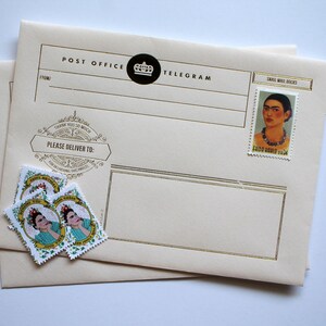 May include: A cream-colored envelope with gold trim and the text "Post Office Telegram" printed on the front. The envelope has a small, black circle with a crown inside. There are three stamps with a woman's face on them and the text "Happy Birthday" and "Thank You" on the envelope.