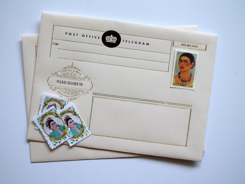 May include: A cream-colored envelope with gold trim and the text "Post Office Telegram" printed on the front. The envelope has a small, black circle with a crown inside. There are three stamps with a woman's face on them and the text "Happy Birthday" and "Thank You" on the envelope.