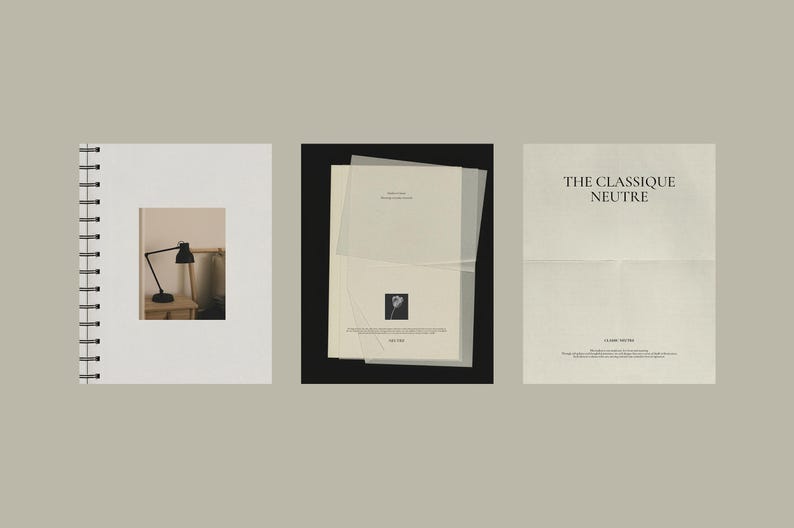Puede incluir: Tres art&iacute;culos de papeler&iacute;a sobre un fondo neutro. Un cuaderno de espiral con una peque&ntilde;a imagen de una l&aacute;mpara de escritorio negra, una pila de papeles con una imagen floral y un papel con el texto "THE CLASSIQUE NEUTRE".