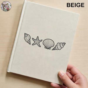 May include: Beige journal with a seashell design. The cover features black line drawings of a conch shell, starfish, scallop shell, and another conch shell. The word "BEIGE" is printed in black in the upper right corner.