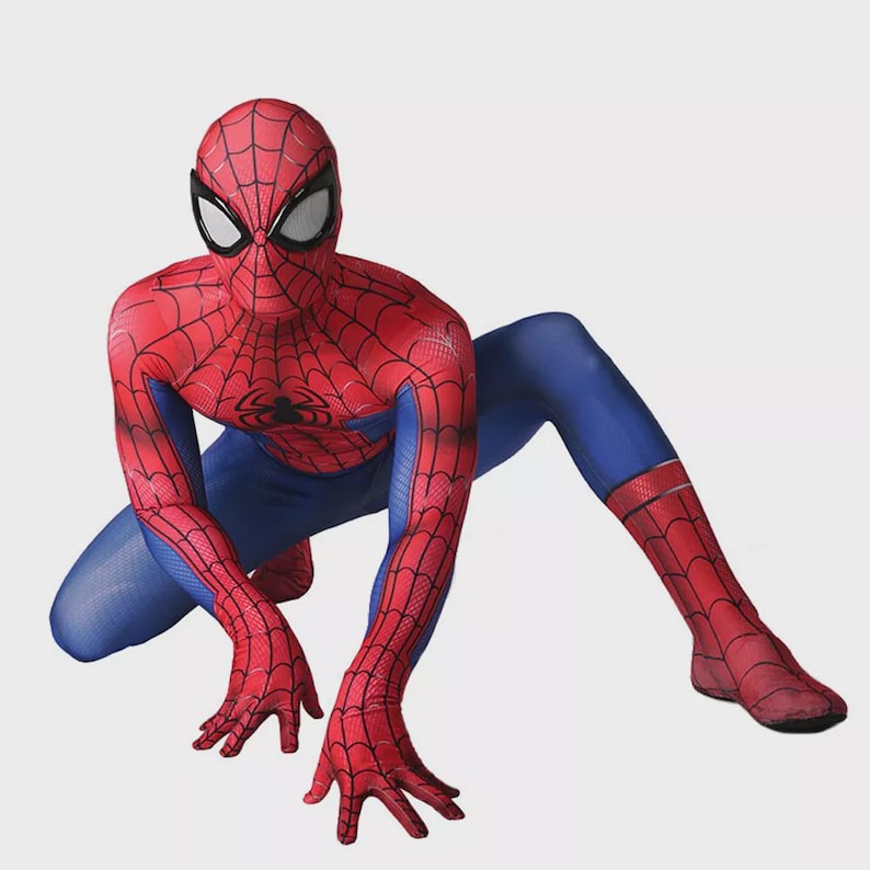 May include: A red and blue Spider-Man costume. The costume features a red mask with black eye coverings, a red body with a black spider emblem, and blue sections on the arms and legs. The costume is designed to resemble the superhero.