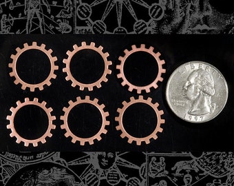 May include: Six copper gears of varying sizes, arranged in two rows of three, on a black background. A silver US quarter is placed to the right of the gears for scale.