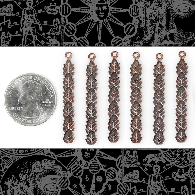 May include: Six antique copper-colored metal charms with a leaf design. Each charm is about the size of a US quarter.