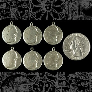 May include: Six silver-toned pendants with a profile of a person's face on each. The pendants are round and have a small loop at the top for hanging. A US quarter is included for size comparison.