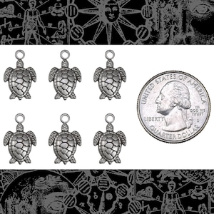 May include: Six silver turtle charms with a loop at the top for attaching to jewellery or other crafts. The charms are about the size of a UK 20 pence coin.