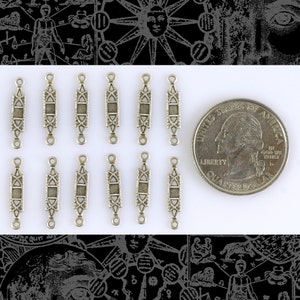 May include: Ten silver-toned metal connector charms with a geometric design. The charms are about the size of a US quarter.