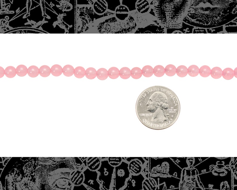 Peut inclure: Un brin de perles rondes roses, d'environ la taille d'une pi&egrave;ce de 25 cents am&eacute;ricaine.