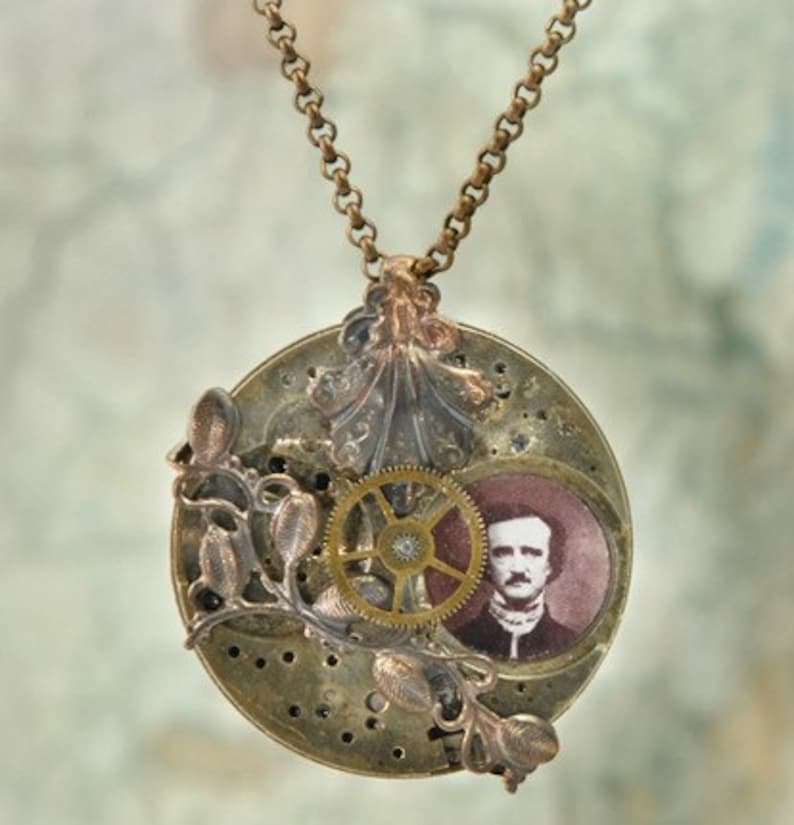 May include: A brass necklace with a round pendant featuring a vintage clock face, a gear, a floral design, and a portrait of Edgar Allan Poe.