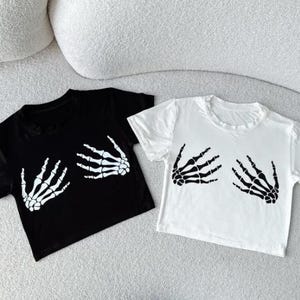 Skeleton Hands Crop Top – Snug Fit Y2K Graphic Tee | Halloween Shirt | Gift for Her | Cute Goth Crop Top | Trendy Gift for Friends