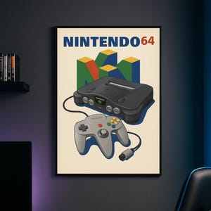 May include: A framed poster showing a Nintendo 64 console and controller. The poster has a cream background with the words "NINTENDO64" in blue and red. The console and controller are grey with colourful buttons.