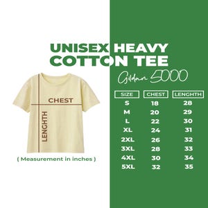 May include: A cream-colored unisex heavy cotton tee shirt with a size chart. The chart lists chest and length measurements in inches for sizes S to 5XL. The shirt is labeled "Gildan 5000".