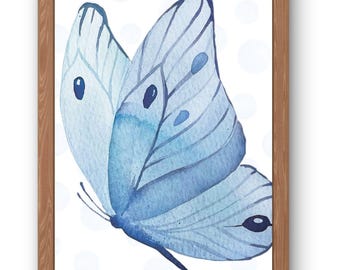May include: Watercolor painting of a blue butterfly with detailed wing patterns, set against a white background with soft blue polka dots. The artwork is framed in a natural wood frame, creating a delicate and artistic aesthetic.