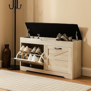 May include: A light wood shoe storage bench with a black cushioned top. The bench has a pull-down shoe rack and a cabinet door with a black handle. Several pairs of shoes are visible.