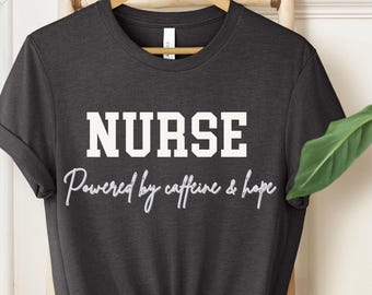 Nurse Shirt | Powered by Caffeine & Hope | Funny Nurse T-Shirt | Nursing Gift | Healthcare Worker Tee