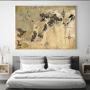 May include: A vintage-style map print featuring a hand-drawn illustration of a fantasy kingdom. The map includes landmarks such as a castle, tower, and various locations, with text labels and a compass rose. The artwork is displayed above a bed.