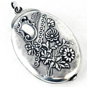 Antique French art nouveau silver slide locket , daisies and feathers